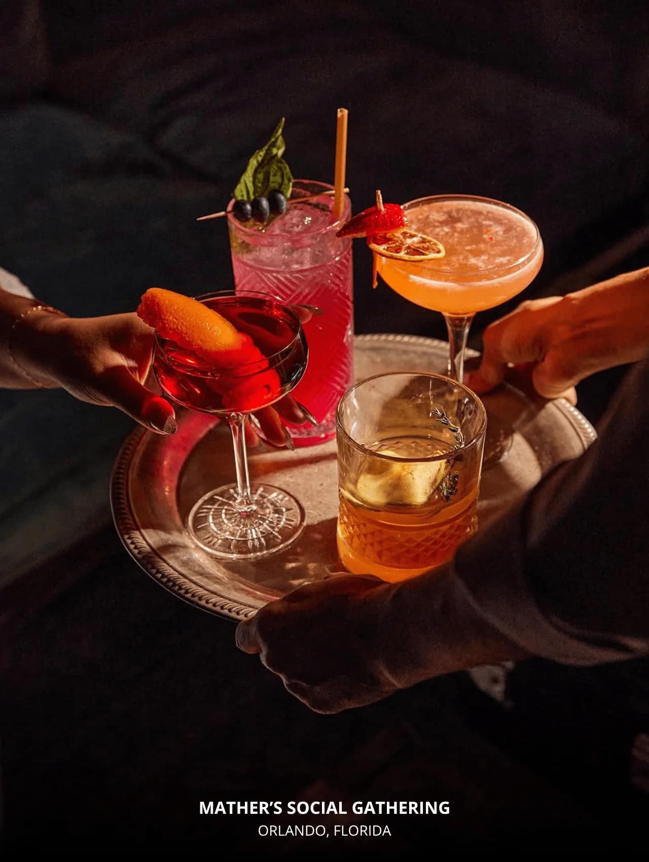 A tray of colorful, elegant cocktails at Mather’s Social Gathering — featured in restaurants with great cocktails in Orlando.