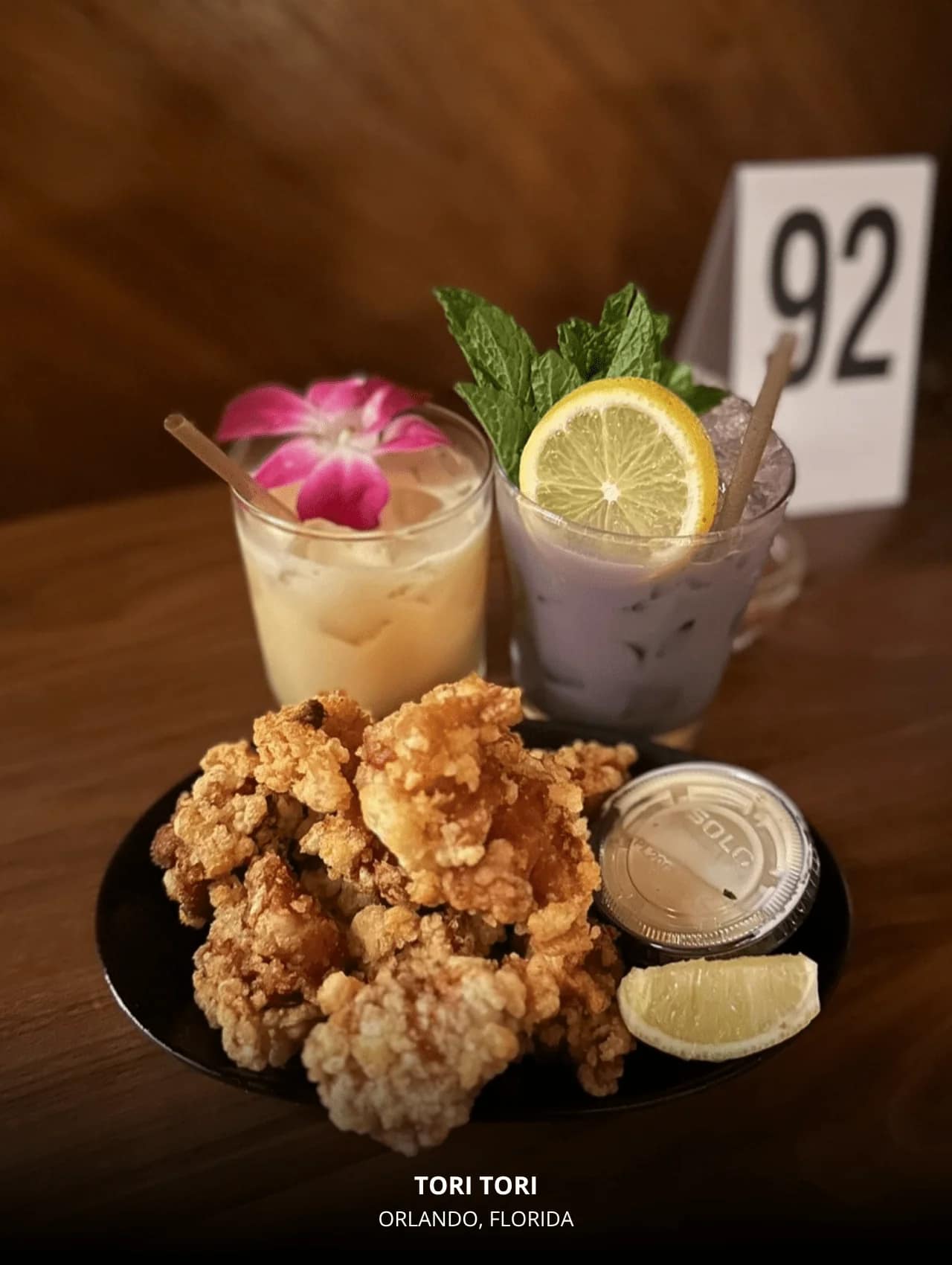 Colorful cocktails and fried chicken dish at Tori Tori — featured in restaurants with great cocktails in Orlando.