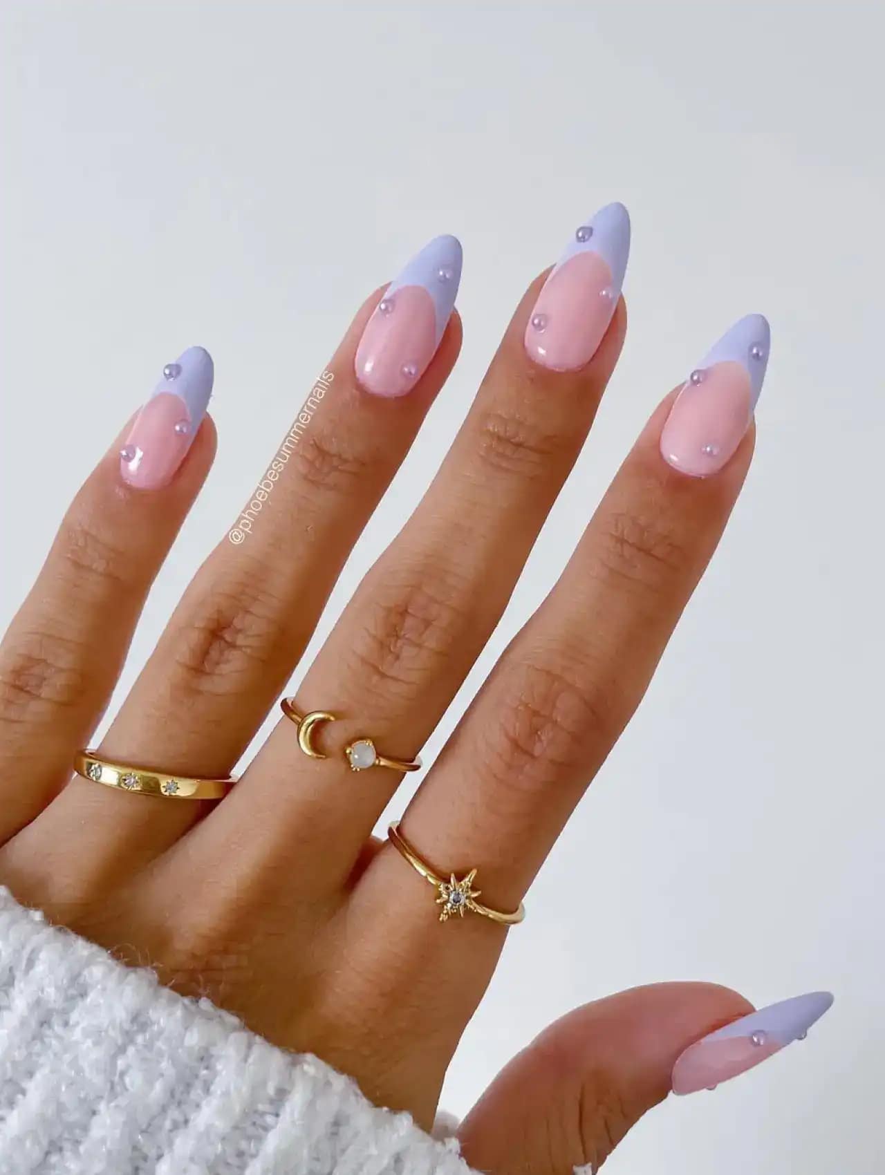 Pink nails with lavender diagonal French tips and rhinestone accents, nail art design 2025.