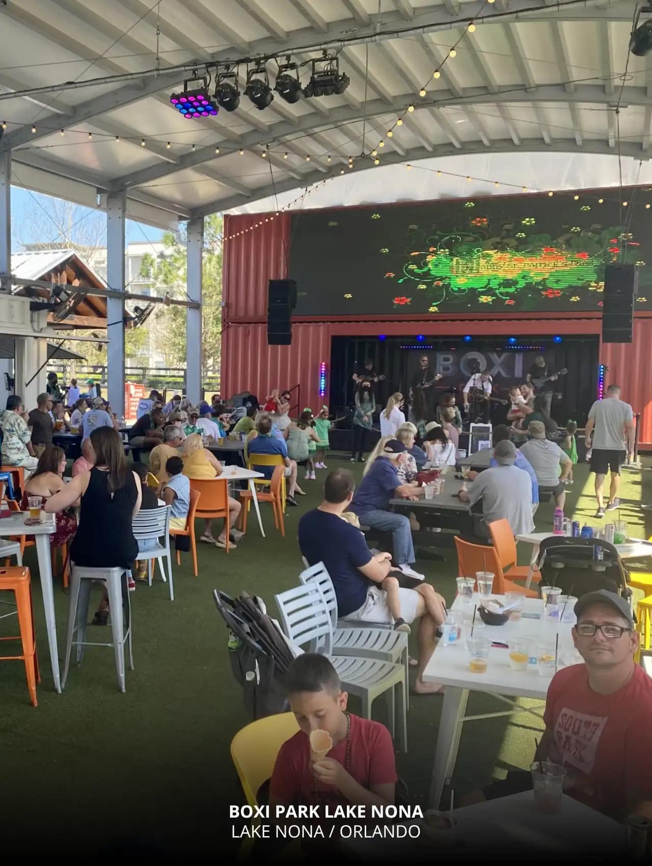 Boxi Park Lake Nona with families enjoying live music and drinks at one of the top sports bars in Orlando.