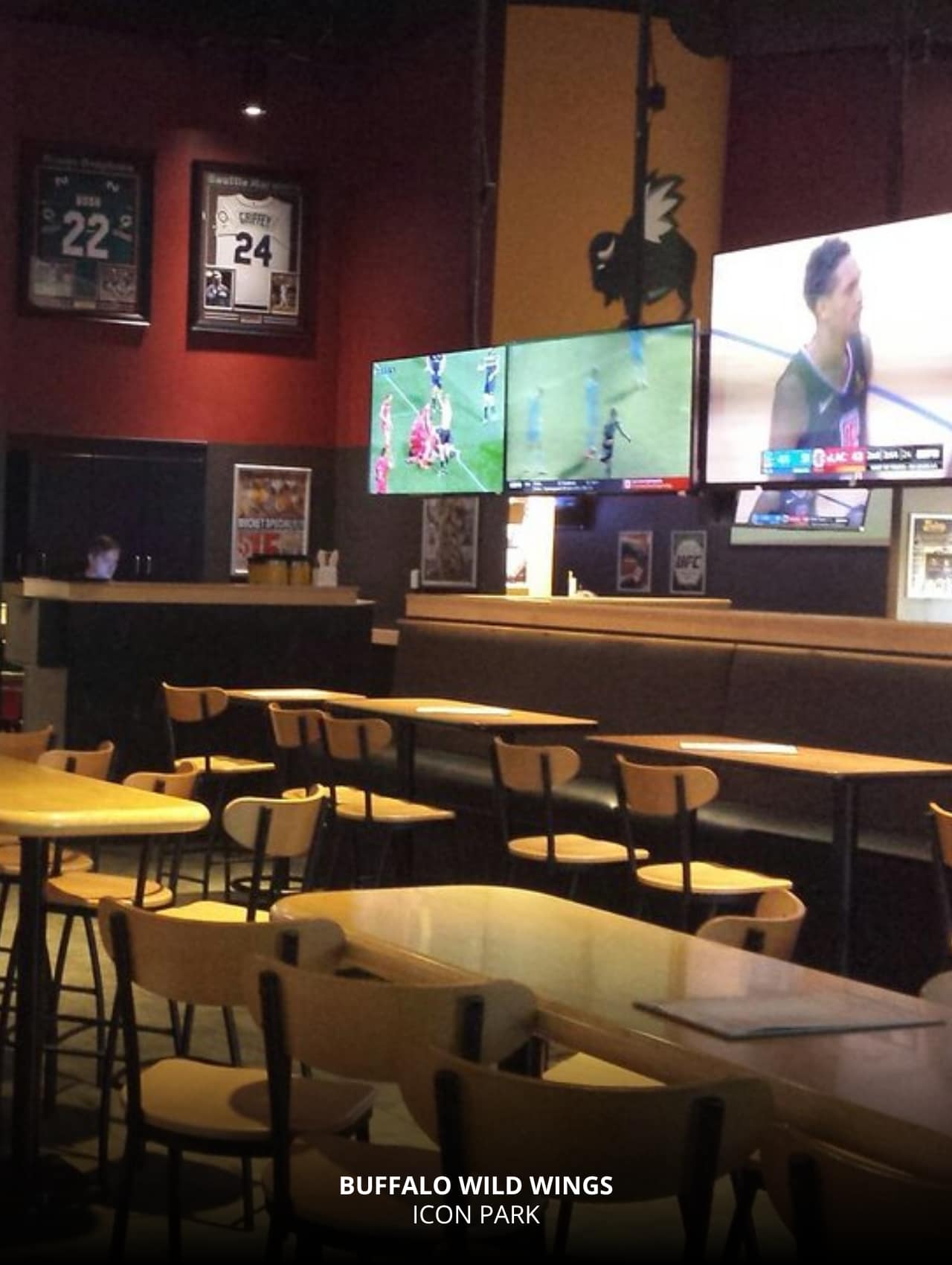 TVs showing sports and memorabilia decor at Buffalo Wild Wings, Orlando Sports Bars